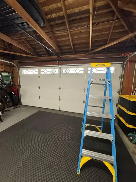 Inspecting a door and opener from inside the garage